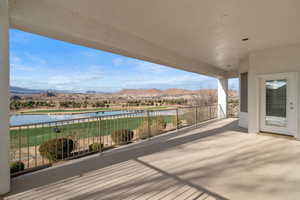 Deck featuring a patio and a water and mountain view
