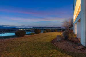 View of grassy yard featuring a mountain view