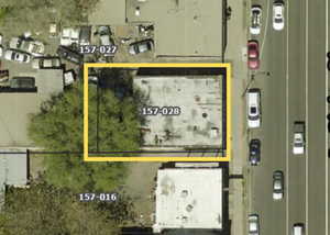 Aerial map of property and surrounding area featuring property boundaries highlighted