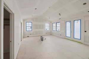 Primary Bedroom w/Vaulted Ceiling and Balcony