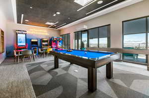 Playroom with billiards table, recessed lighting, and an AC wall unit