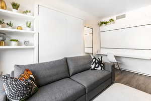 Living area with wood finished floors