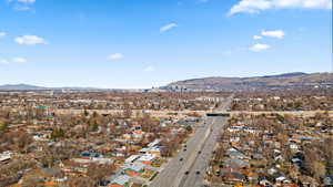 View of property location featuring a mountainous background and nearby suburban area