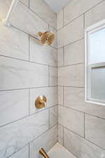 Bathroom view of tub / shower combination