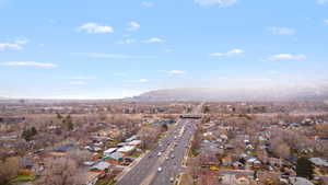 View of property location with a mountainous background and nearby suburban area