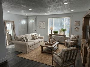 Living room featuring plenty of natural light, a textured ceiling, wood finished floors, and recessed lighting