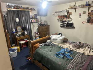 Bedroom with a textured ceiling