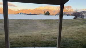 View of yard featuring a mountain view and a patio
