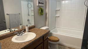 Full bath featuring vanity and shower / bathtub combination