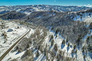 Snowy aerial view with a mountain view