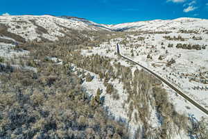 Snowy aerial view with a mountain view