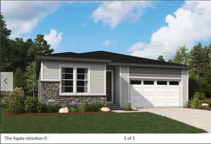 View of front of home with stone siding, concrete driveway, a front lawn, and a garage