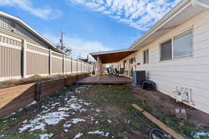 Fenced yard with a wooden deck