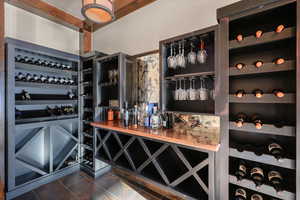 Wine area featuring dark tile patterned floors