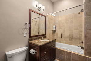 Bathroom featuring vanity and tiled shower / bath combo