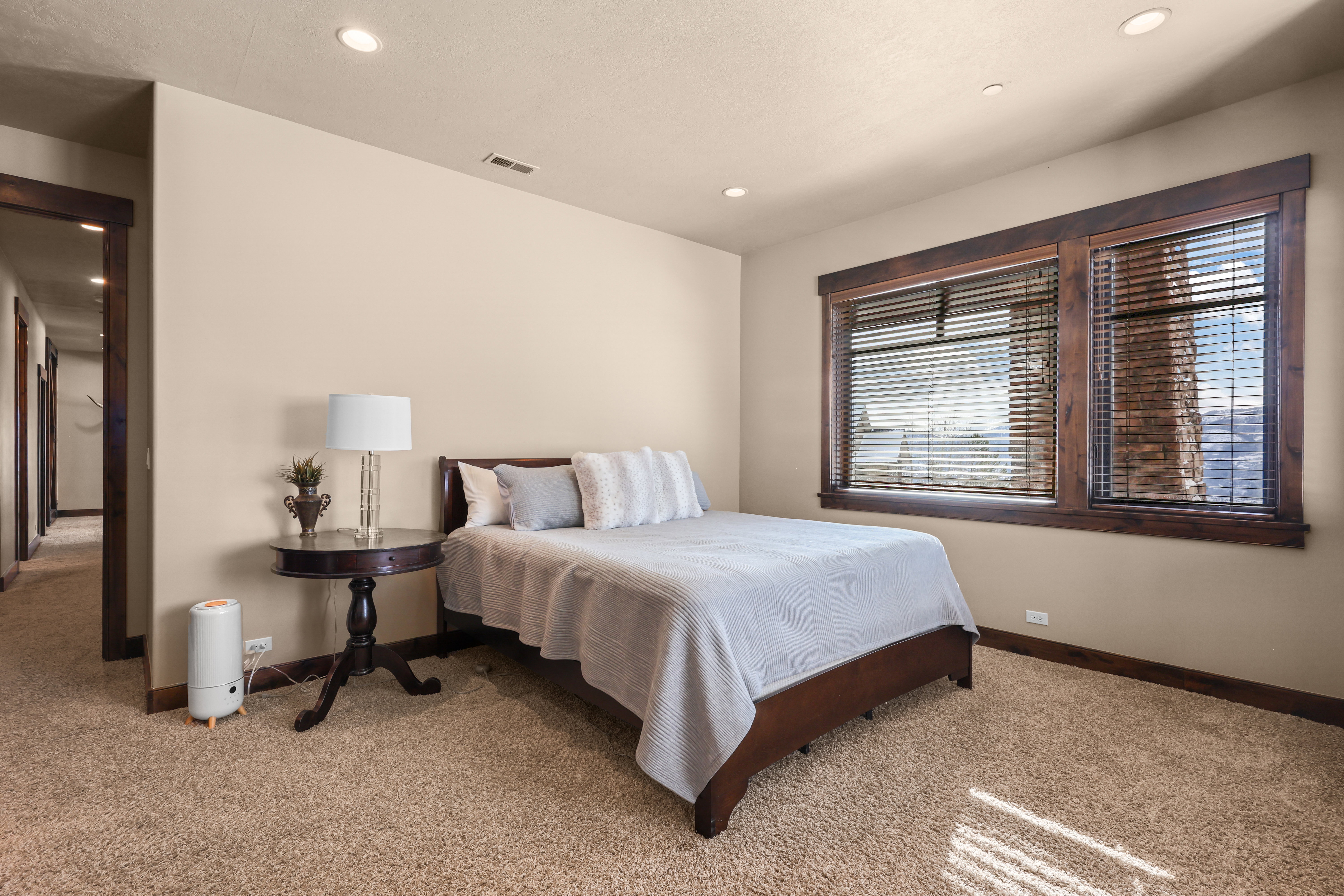 Bedroom featuring light colored carpet and recessed lighting