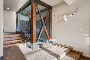 Stairway featuring carpet