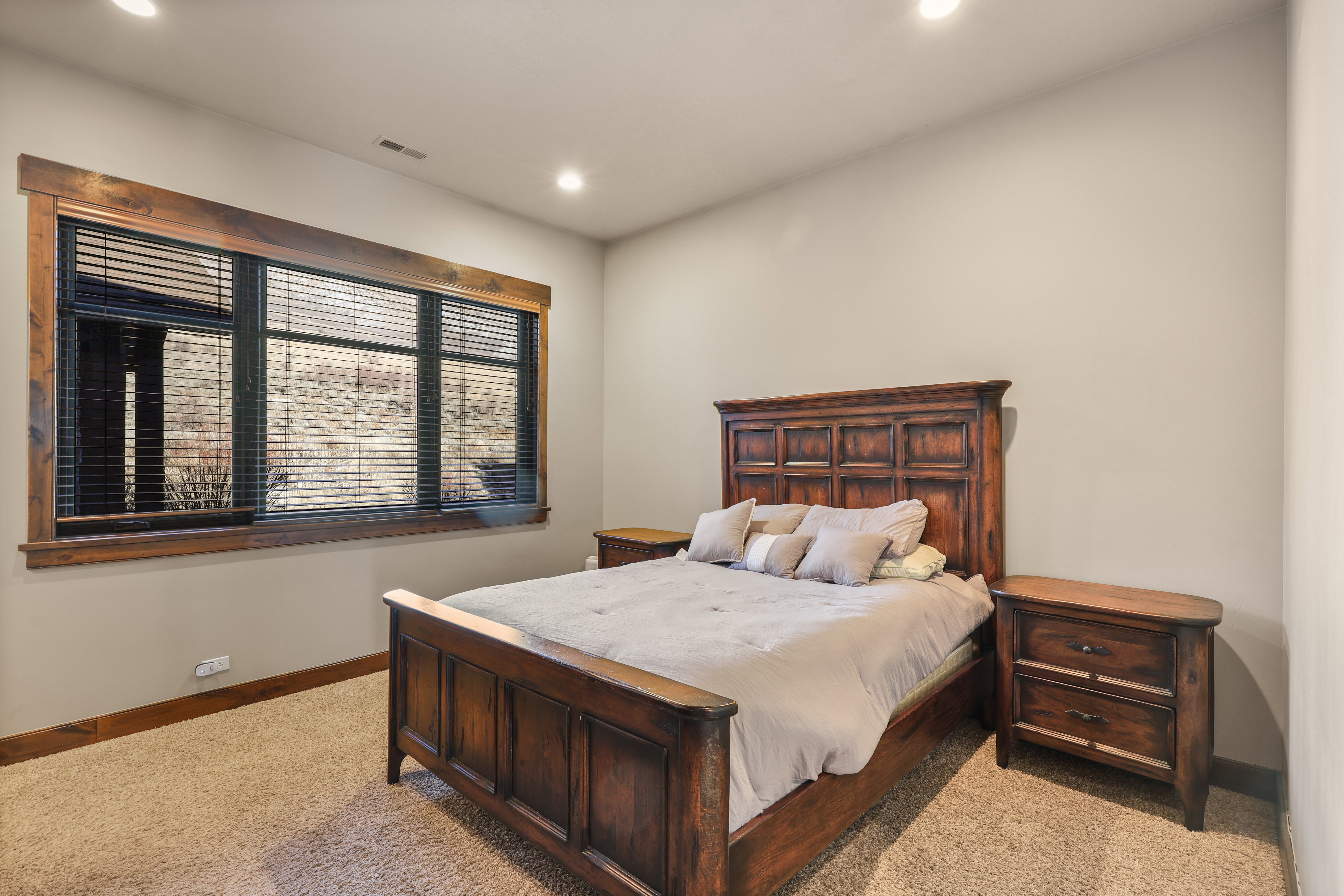 Bedroom featuring light colored carpet and recessed lighting
