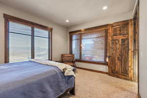 Bedroom with carpet floors and recessed lighting