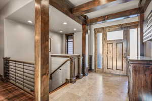 Entrance foyer featuring recessed lighting and beam ceiling