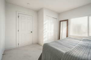 Bedroom featuring carpet floors and a closet