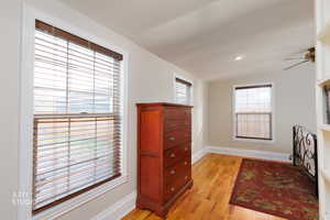 Interior space with light wood-type flooring, ceiling fan, recessed lighting, and vaulted ceiling