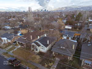 Aerial perspective of suburban area with skyline and a mountainous background