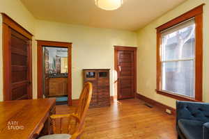 Office area featuring light wood-style flooring and baseboards