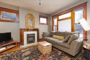 Living room with hardwood / wood-style floors and a fireplace