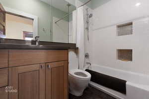 Full bathroom with shower / bath combo and vanity