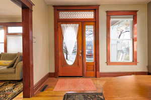 Entryway with wood finished floors and healthy amount of natural light
