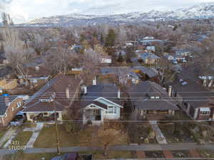Aerial perspective of suburban area featuring a mountain backdrop