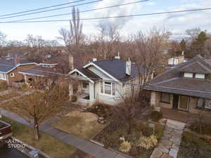 View of front of property featuring roof with shingles and a residential view