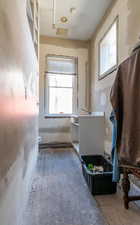 Half bathroom with vanity and plenty of natural light