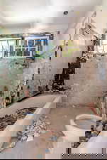 Full bath with toilet and a bath