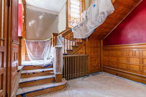 Stairs with a wainscoted wall