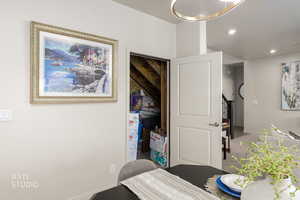 Carpeted dining room featuring baseboards