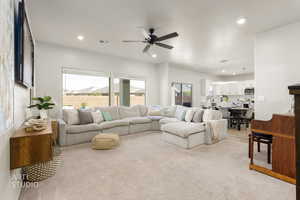 Living room with recessed lighting, light colored carpet, and a ceiling fan