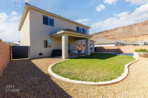 Back of property with a patio, stucco siding, and a fenced backyard