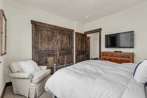 Bedroom featuring a closet and baseboards