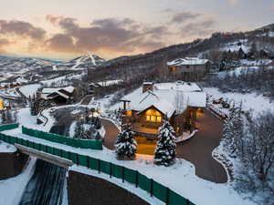 Snowy aerial view featuring a mountain view