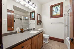 Bathroom with vanity and light tile patterned floors