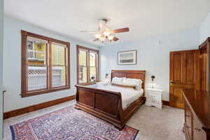 Bedroom featuring baseboards and ceiling fan