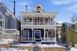 View of front of house with covered porch