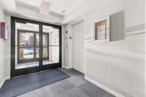 Building lobby with elevator to garage parking