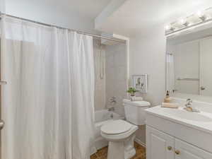 Bathroom with vanity and shower / bathtub combination with curtain