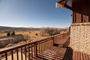 Wooden terrace with a rural view and a mountain view