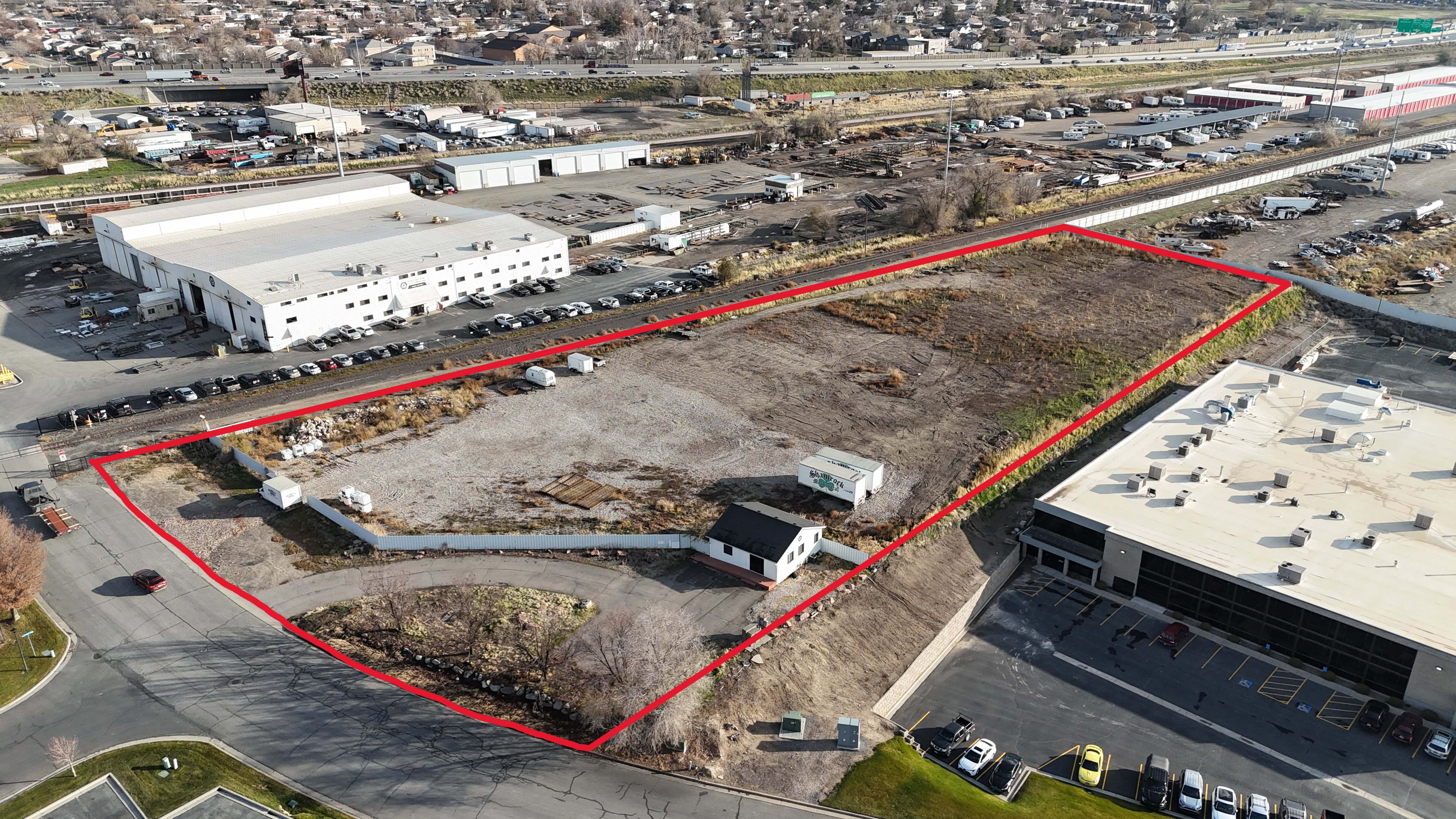 Aerial view of property and surrounding area with property boundaries highlighted