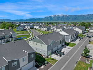 Aerial view of residential area featuring a mountainous background