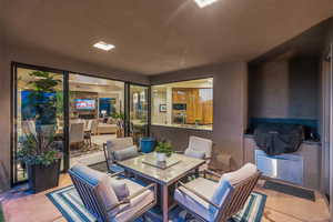 View of patio / terrace featuring outdoor dining space and a grill